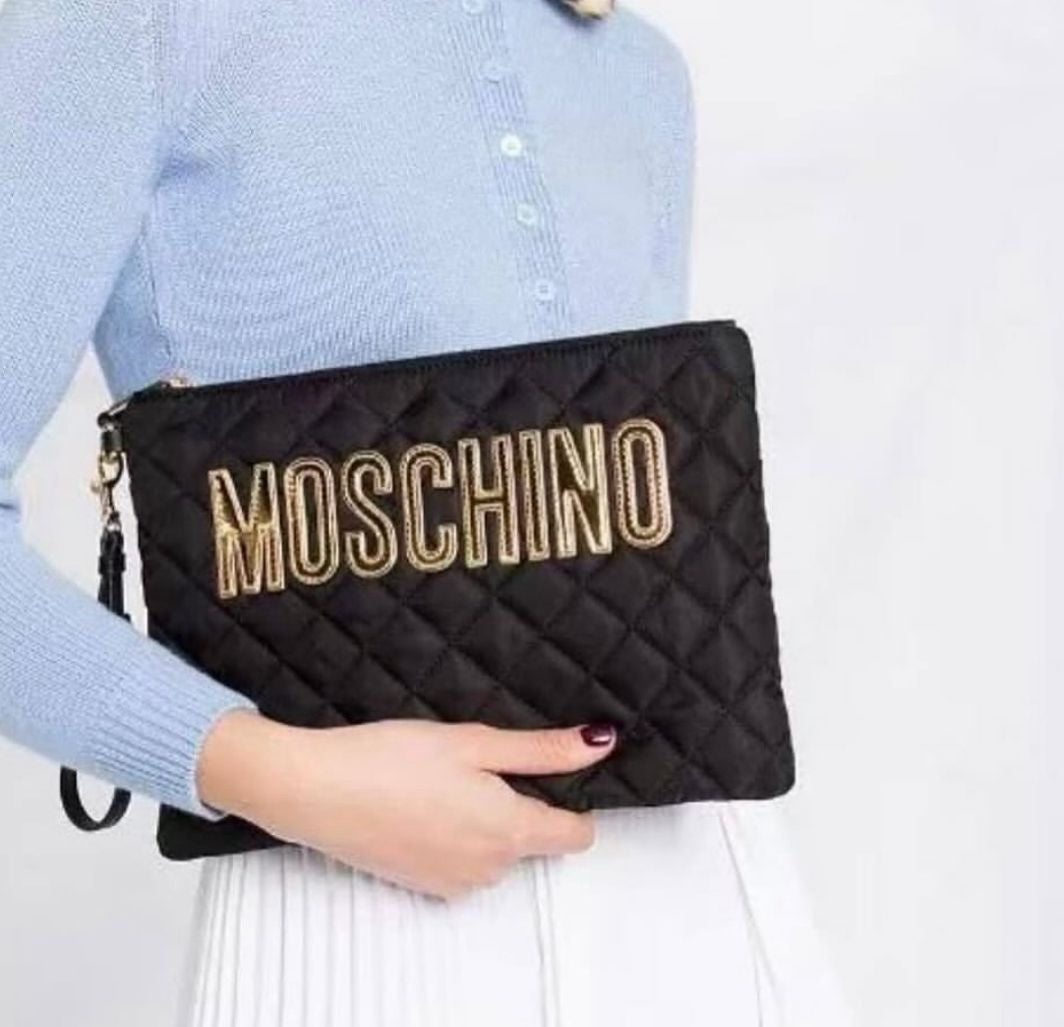 Moschino logo-patch quilted clutch bag