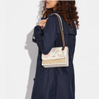 Coach Klare Crossbody bag in signature canvas with a floral print