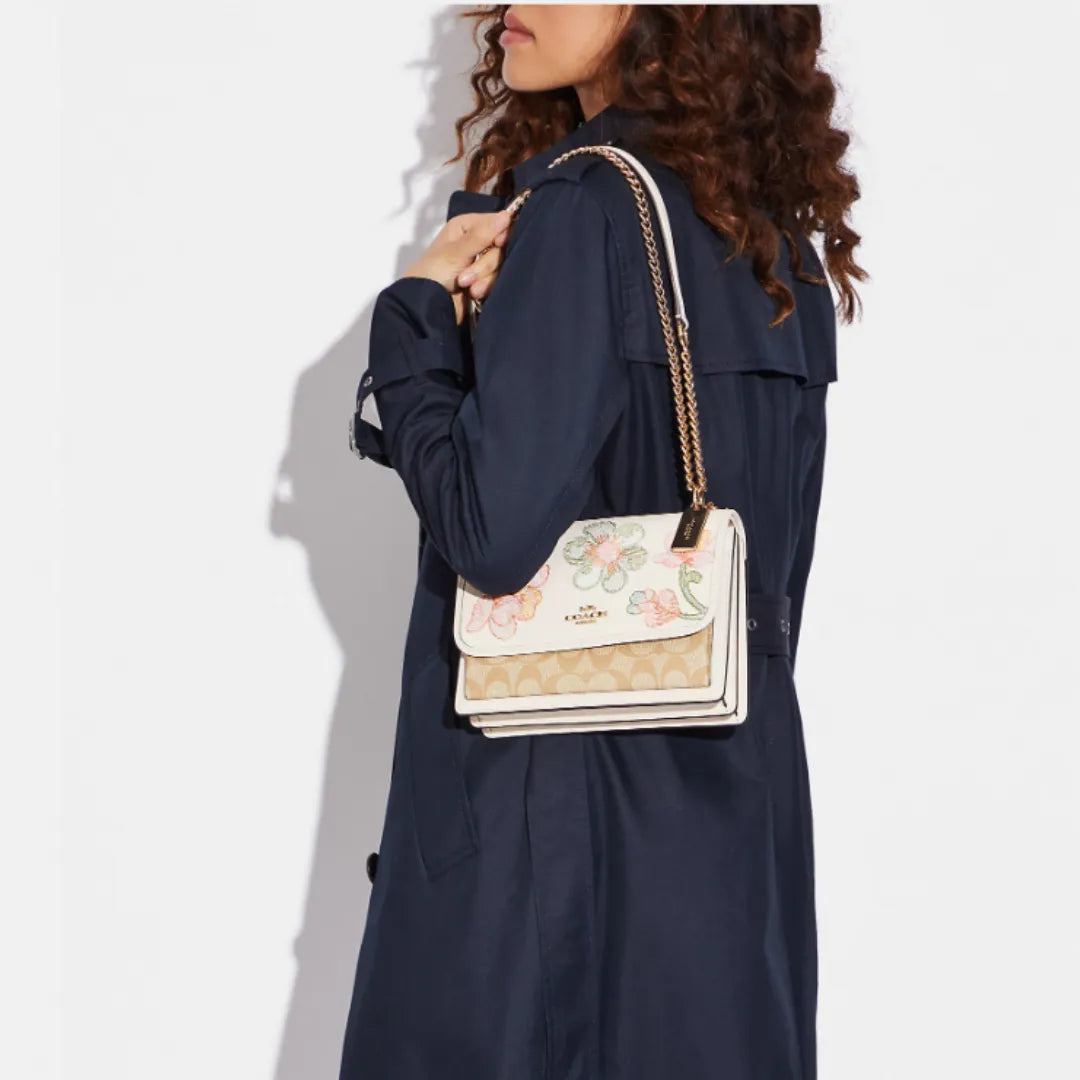 Coach Klare Crossbody bag in signature canvas with a floral print