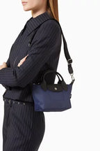 Longchamp
Le Pliage Energy XS Handbag