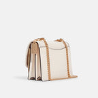 Coach Klare Crossbody bag in signature canvas with a floral print