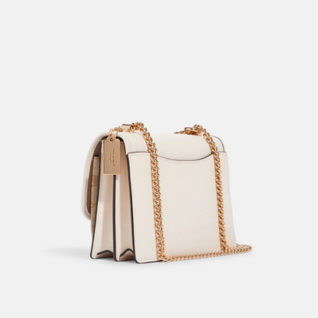 Coach Klare Crossbody bag in signature canvas with a floral print