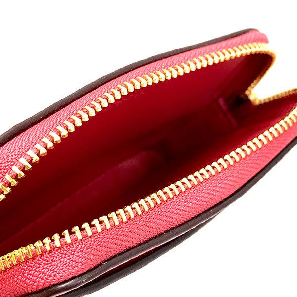 COACH 
Pebbled Leather Zip Card Case