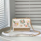 Coach Klare Crossbody bag in signature canvas with a floral print