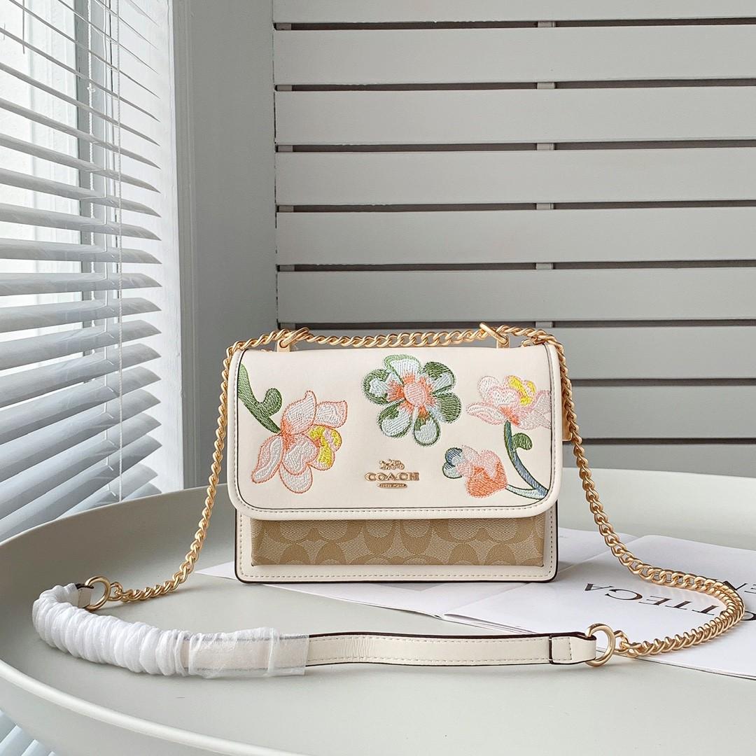 Coach Klare Crossbody bag in signature canvas with a floral print