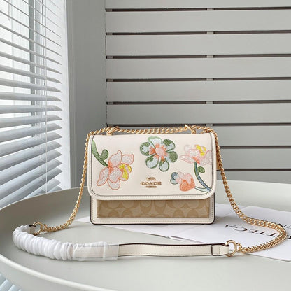 Coach Klare Crossbody bag in signature canvas with a floral print