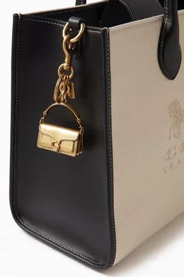 COACH
Tabby Bag Charm in Plated Metal
