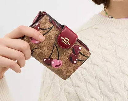 Coach Medium Corner Zip Wallet in Signature Canvas with Cherry Print.